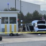 Man Charged After Ramming Car into FBI Gate with Flag